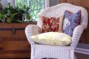 Wicker Chair White, with Red and Blue Pillows